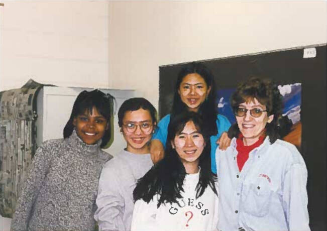Students smiling and looking at camera